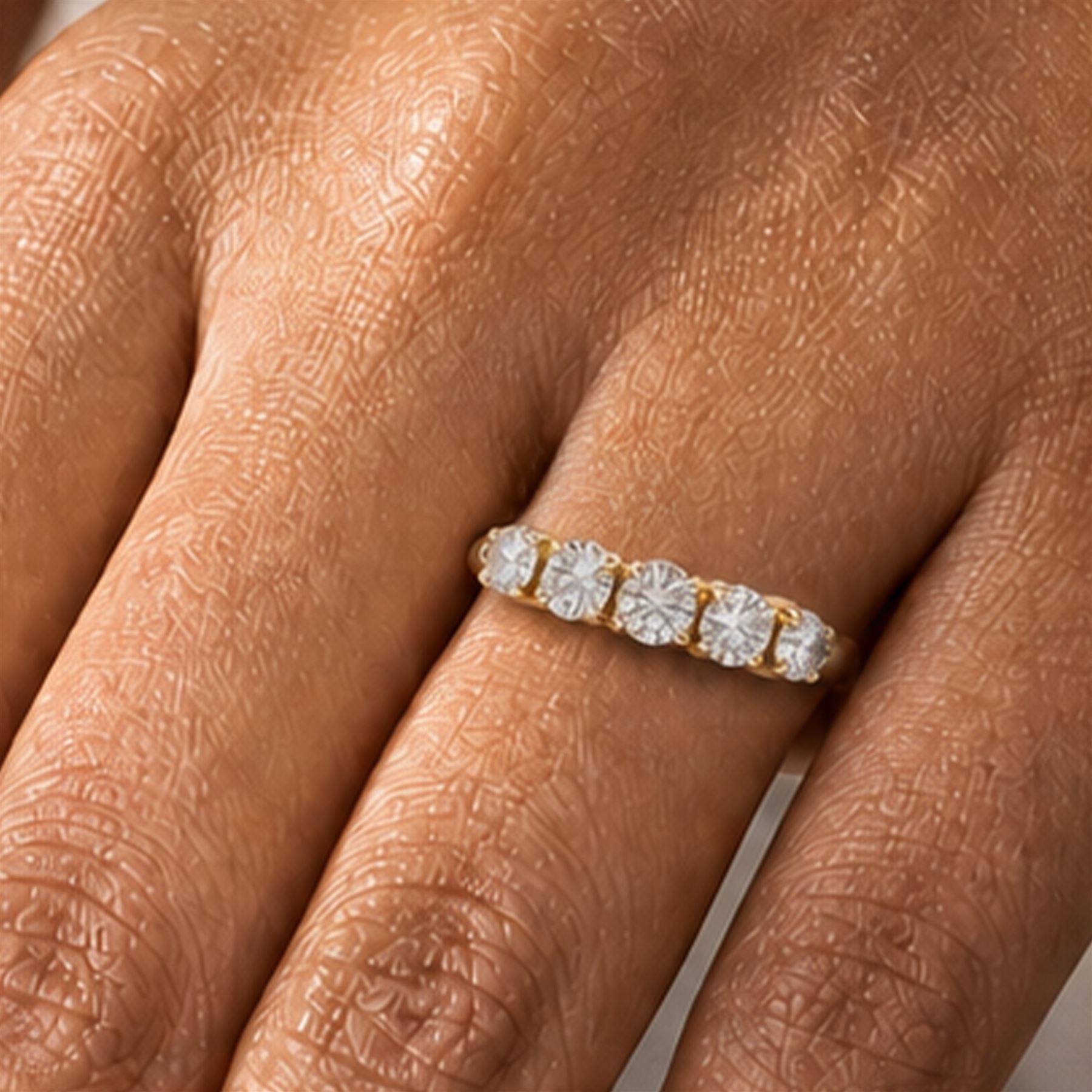 18ct gold diamond ring, set with five graduating round brilliant cut diamonds, London 2015, total diamond weight 1.21 carat