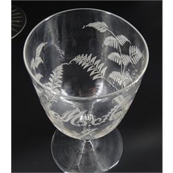 Large 19th century glass goblet, the bowl engraved with panels of flowers, upon a faceted baluster stem and circular foot with star cut base, H20.5cm, together with two smaller 19th century examples, the bowls engraved with initials 'M.A.F.' and 'M.A.F. J.F.', within foliate surrounds, tallest H16cm