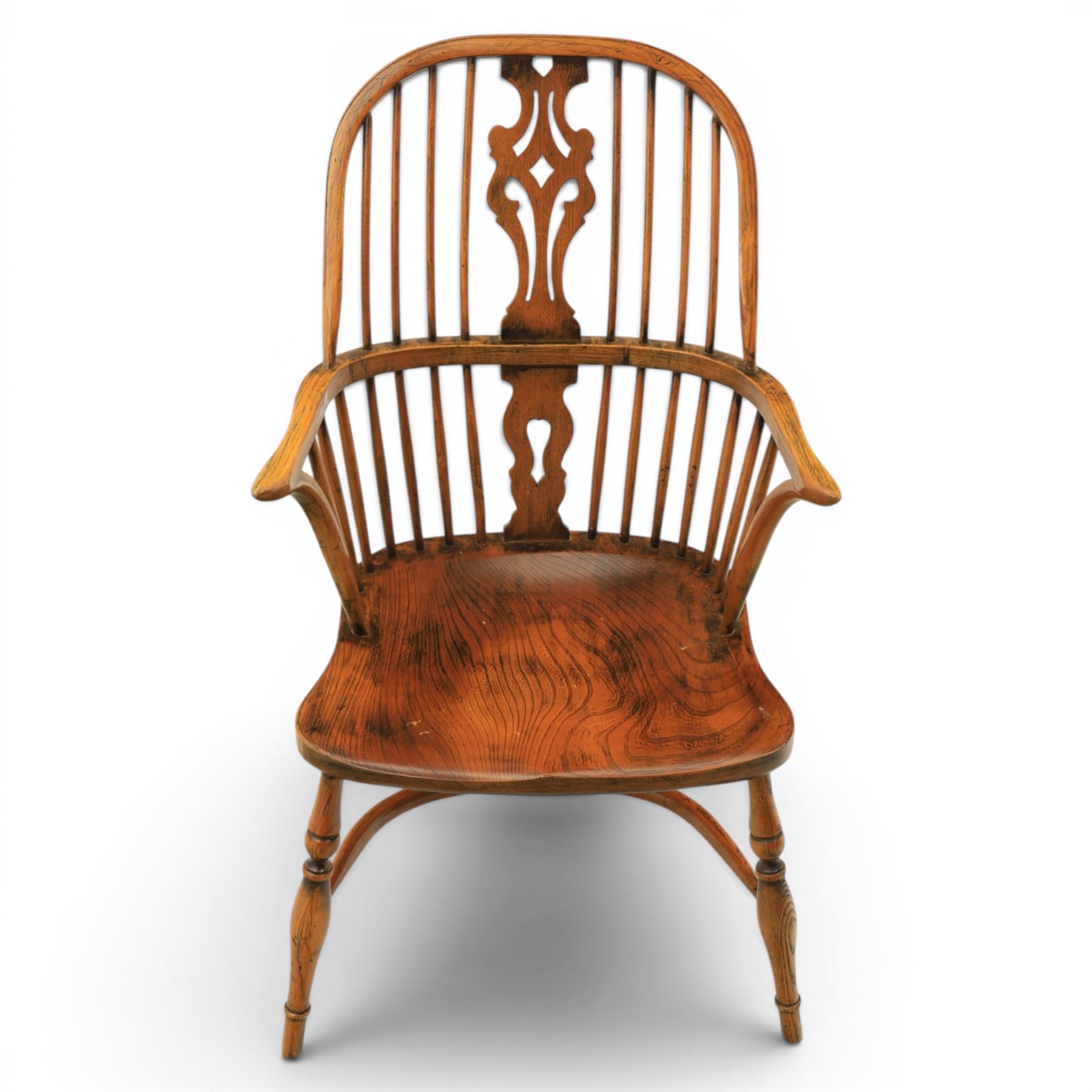 Pair of high back Windsor armchairs, fleur de lis back splat, dished seat, caroline stretcher