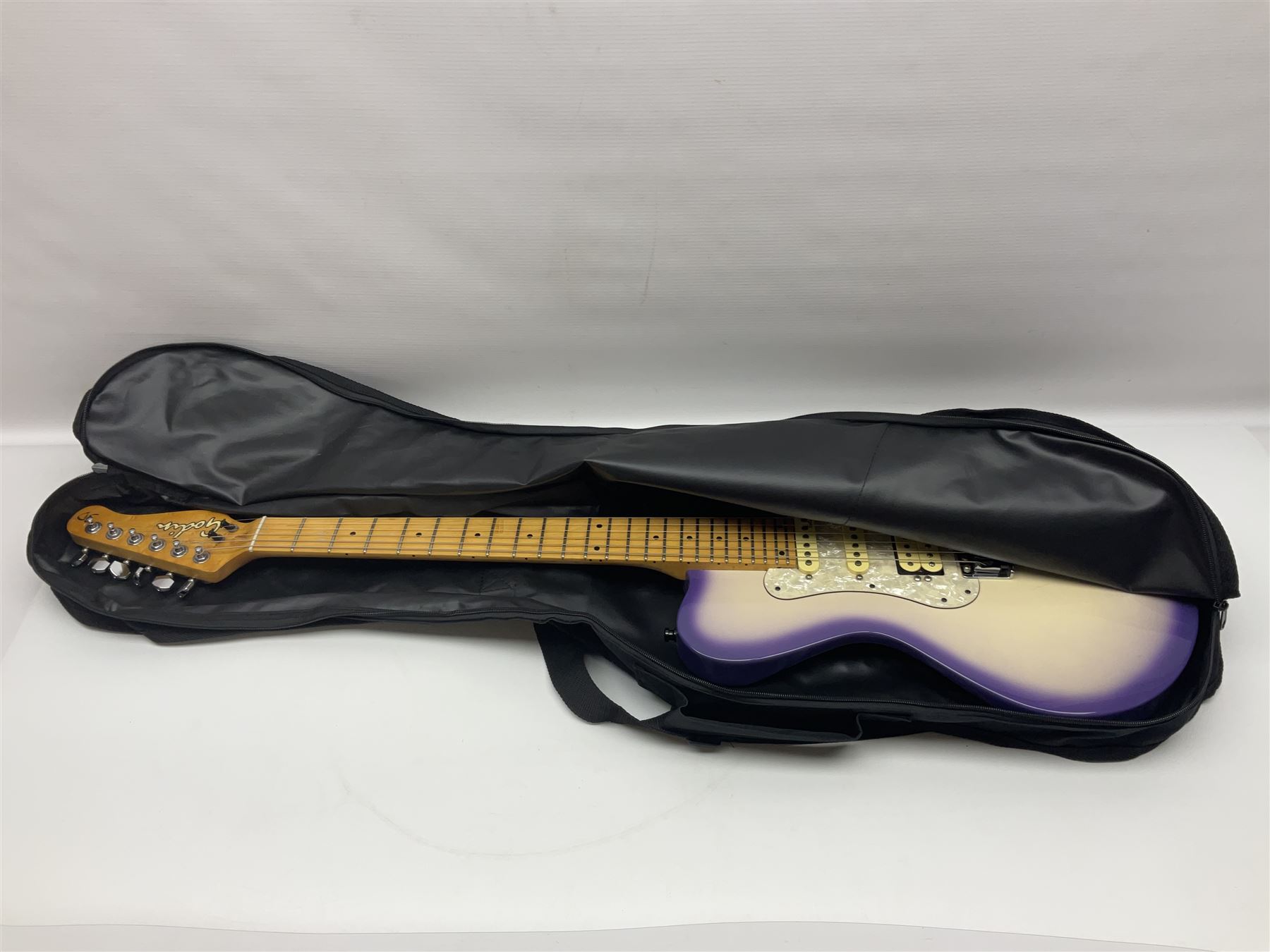 Canadian Godin SD electric guitar in two-tone purple/white with bird's eye maple neck and tremolo, serial no.98455463, L100cm overall; in soft carrying case.