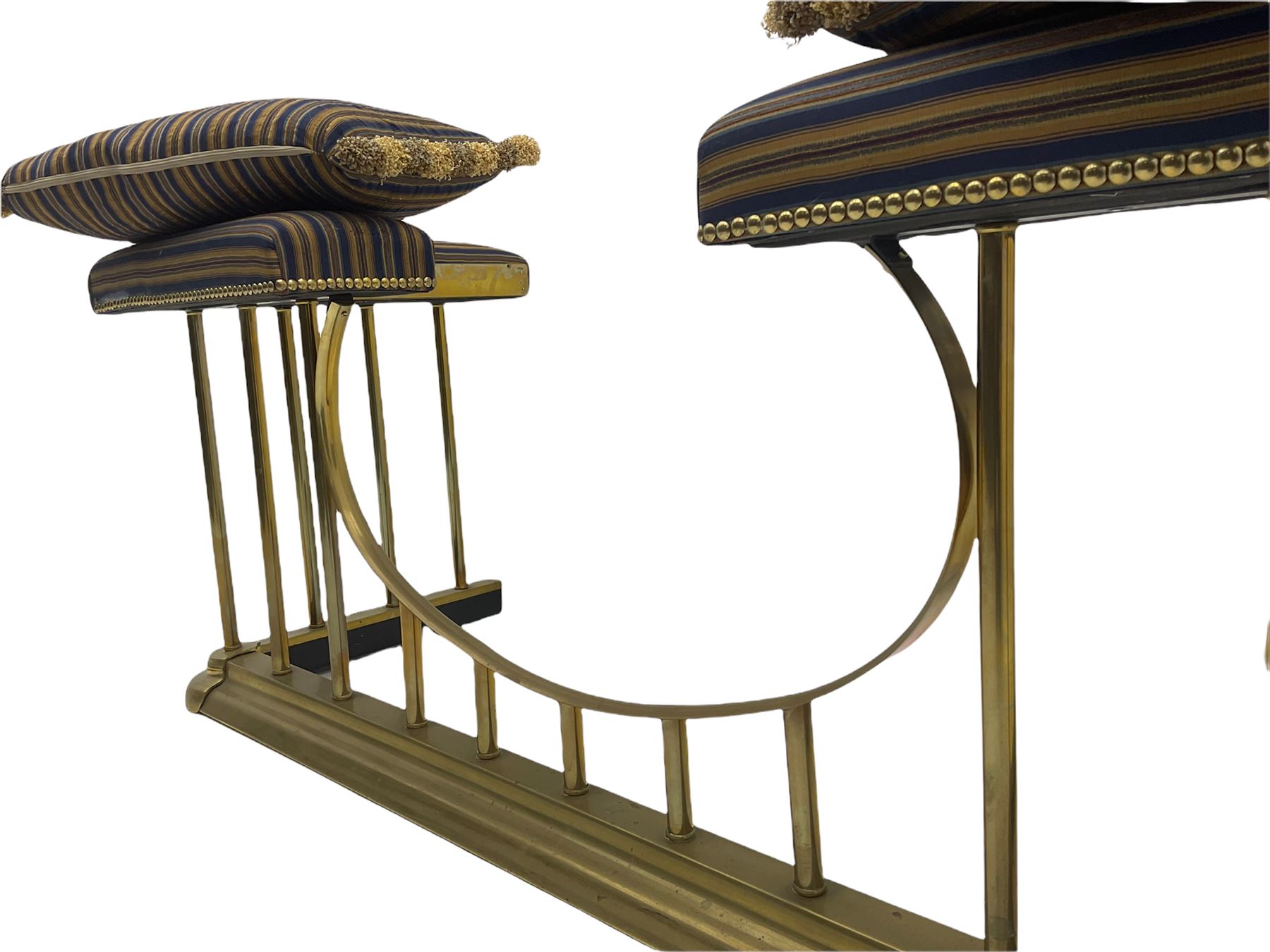 20th century brass club fire fender, striped upholstered corner seats