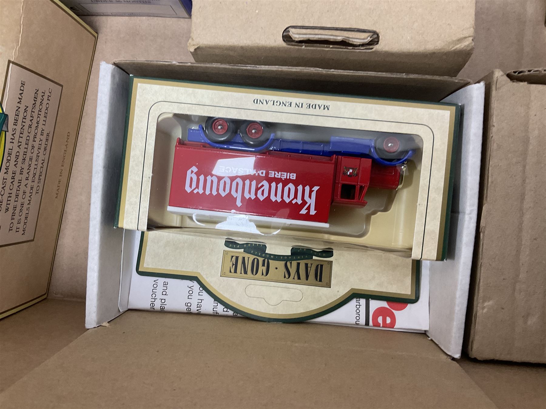 Collection of Tetley Tea collectibles to include sixteen 1:43 scale model cars from Lledo and Oxford Die-Cast with further Tetley Tea figures and tinned coaster set