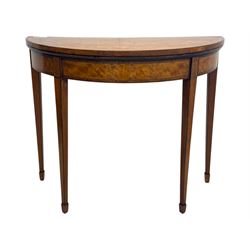 Edwardian satinwood inlaid demi-lune card table, hinged fold over green baize lined interior, raised on square tapered supports with spade feet  