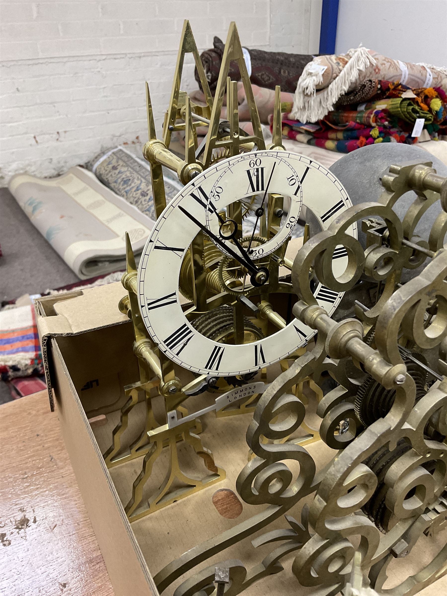 Two skeleton clock movements, tavern clock movement, and further clock movements, all for restoration 