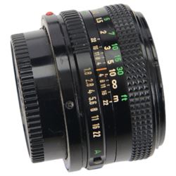 Collection of Canon camera lenses and accessories, including EF 50m 1:1.4 lens, EF 35mm 1:2 lensFD 28mm 1:2.8 lens, FD 50mm 1:1.8 lens, FD 135mm 1:2.5 S.C lens, FD35-70mm 1:3.5-4.5 lens, three Speedlite 550EX flashes, Transistor pack E, lens hoods, battery chargers, etc 