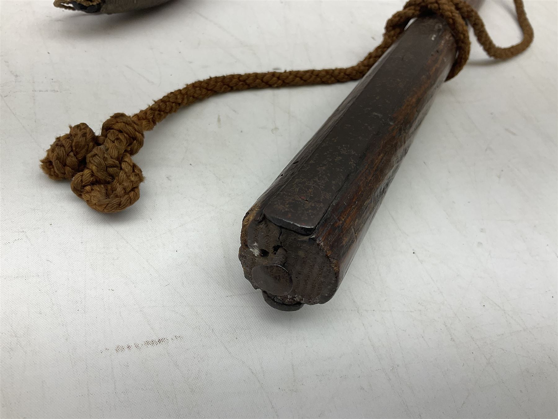 Tribal Art - an African axe, possibly Yoruba, the bone shaft carved as two cord bound stylised figures with iron fan-shaped blade, L35cm overall; and 19th century harpoon or spear head of square section with two long fixing arms on cut-down ash shaft L57cm (2)