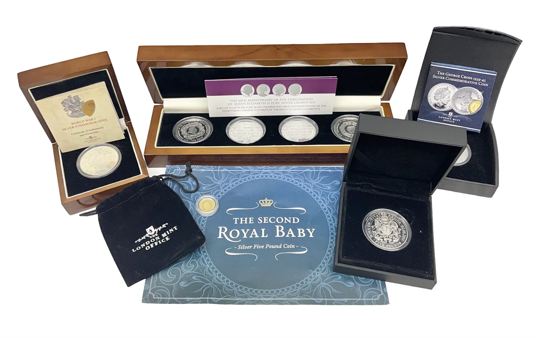Commemorative Tristan Da Cunha coins including 2013 'The 60th Anniversary of the Coronation of Queen Elizabeth II Pure Silver Crown Set' cased with certificate,  2014 'World War I Silver Commemorative' one crown cased with certificate, 9ct gold 2012 half crown approximately 1 gram etc
