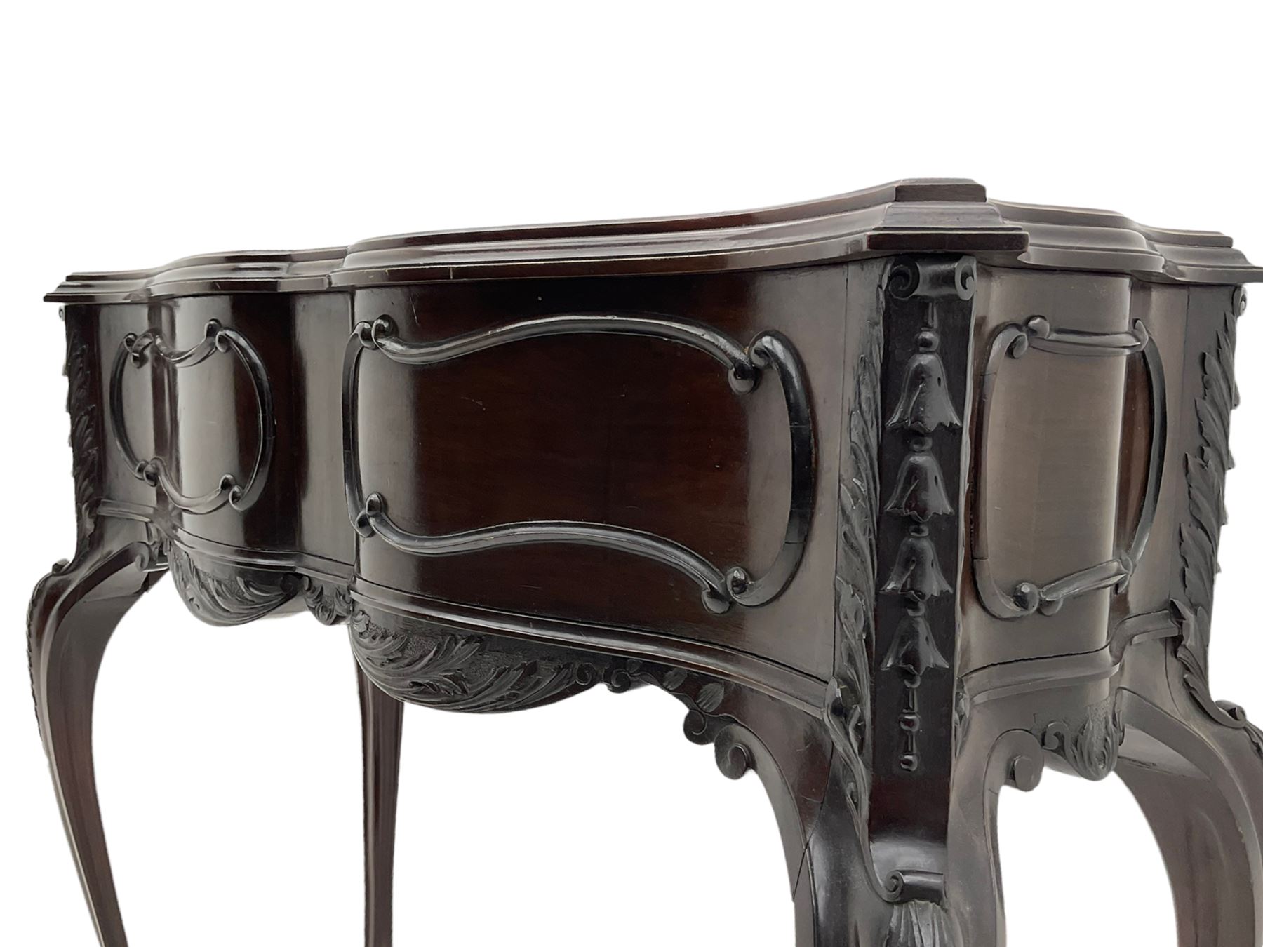 Late Victorian mahogany jardiniere planter stand, shaped form with fixed moulded top, applied c and s scroll mouldings and husks to the frieze and canted corners, acanthus carved cabriole supports with scroll carved terminals, 91cm x 37cm, H85cm