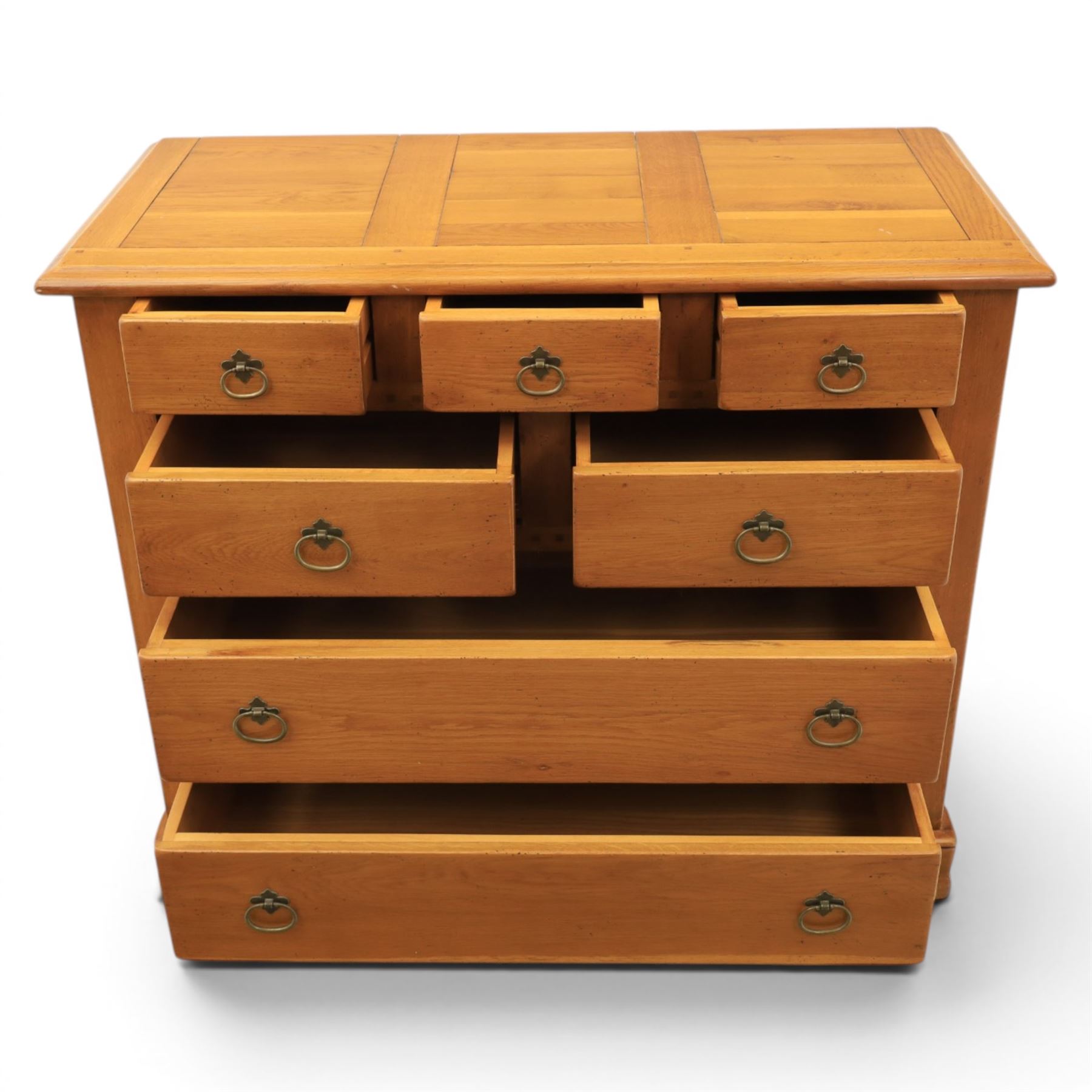 Solid oak chest, fitted with an arrangement of five short and two long drawers