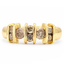 18ct gold fancy champagne / brown diamond ring, two round brilliant cut diamonds, spaced b...