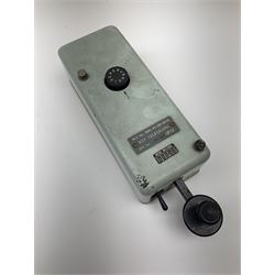 German bakelite morse code key marked 'Entstort' and 'D.R.P. Junker' L15cm; another bearing plaque 'N.S. No.5805-99-580-8558 KEY TELEGRAPH Ser. No. PES597 1973'; and two 1970s turn-dial Trimphones (4)