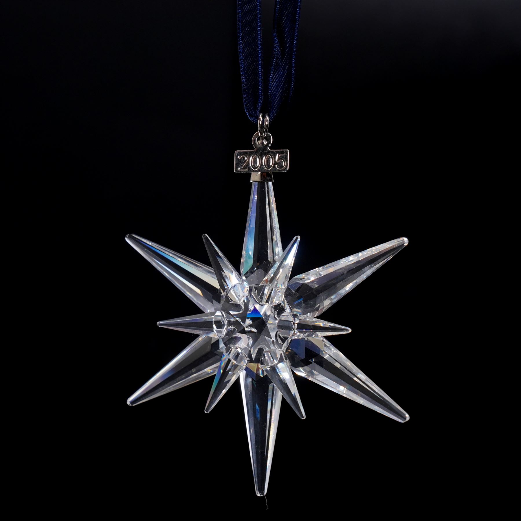 Nine Swarovski crystal snowflake Christmas ornaments, comprising years 1999-2005, 2010 and 2011, some with certificates, boxed (9)