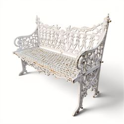 Victorian revival heavy cast iron garden bench, ornate back rest with scrolls, floral motifs and central crest, pierced lattice seat, curved arms and decorative legs, painted in antique white, in the Gothic Coalbrookdale style - Damaged 