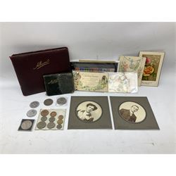 Coins and ephemera, including commemorative crowns, Queen Elizabeth II 1953 nine coin set in blister pack, vintage greetings type cards, stamps, early 20th century scrap album etc