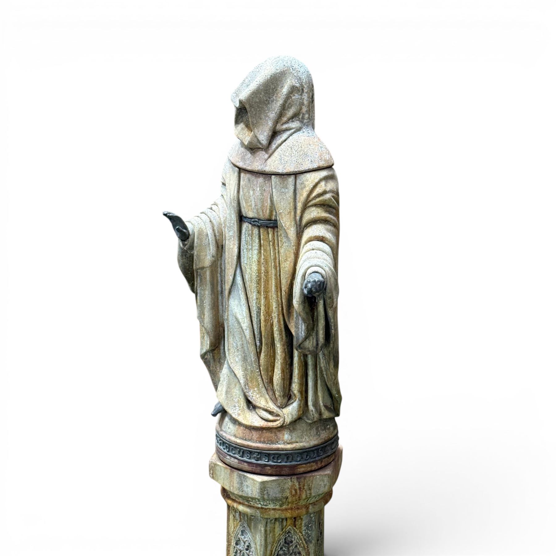 Farran stone garden statue depicting a hooded monk standing in flowing robes in circular form, set upon Gothic pedestal with arched panels, featuring lead hands and script band