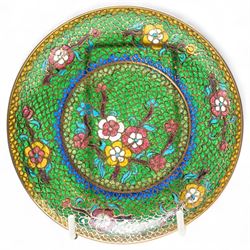 Pierced plique-à-jour dish, the floral decoration dispersed on a green ground, D13cm