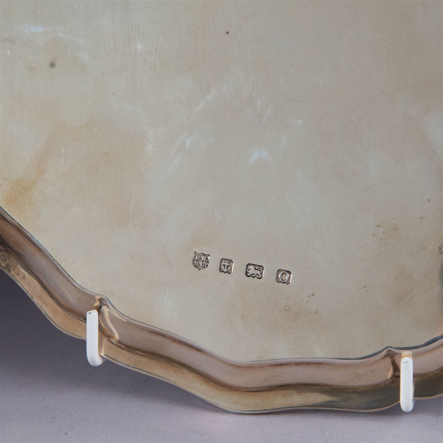 1930s silver salver, of circular form with beaded pie crust rim and upon four claw and ball feet, with presentation engraving to centre reading 'Presented to Second Lieutenant FR Himsworth Royal Signals by the Officers of the 50th Nottingham Motor Divisional Signals on the Occasion of his Marriage 10th September 1939', bordered by the engraved signatures of his colleagues, hallmarked Barker Brothers Silver Ltd, Birmingham 1938, D25cm