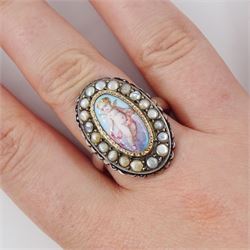 19th century French silver enamel portrait ring, set with an oval hand painted panel of a cherub, with split pearl surround