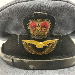 QEII RAF uniform of tunic, trousers and visor cap with Queen's Crown buttons, cuff rank braid for Flight Lieutenant, Navigator's Brevet badge, Gulf War Medal ribbon bar with MID rosette and Moss Bros. label to 'Pilot Officer K.P. Bazeley 3770 11/85'