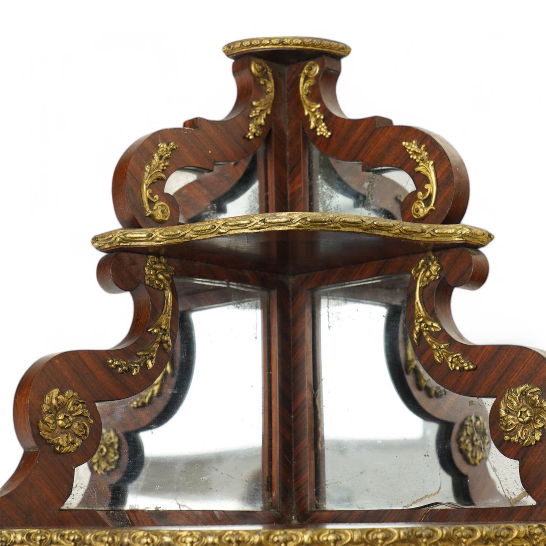 Pair of late 19th to early 20th century Kingwood and ormolu mounted encoignure or wall hanging corner cabinets, shaped end supports with mirror backs, serpentine double cupboard mounted by sevres design porcelain panels, decorated with foliate cast metal mounts, the interior fitted with shelf