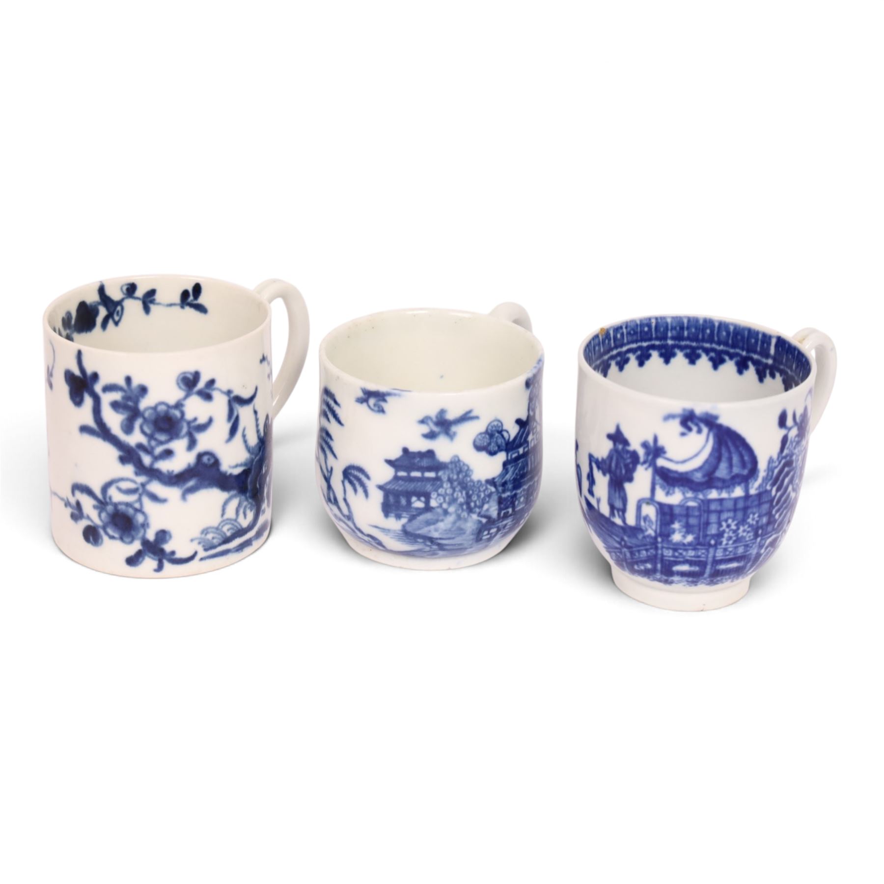 Worcester blue and white coffee cup, decorated in the Fisherman or Pleasure Boat pattern, circa 1775, together with a Worcester blue and white coffee can, decorated in the Prunus pattern, circa 1770-1775, and a Caughley blue and white custard cup, decorated in the Willow Nankin pattern, circa 1784-1792, each with marks beneath, custard cup H5.5cm