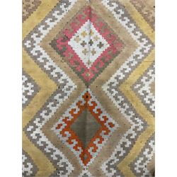 South West Persian Qashgai Kilim, mustard ground and decorated with geometric lozenges and borders 