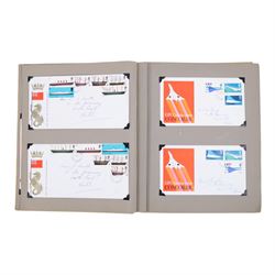 Collection of postcards in a album, together with an album of first day covers 
