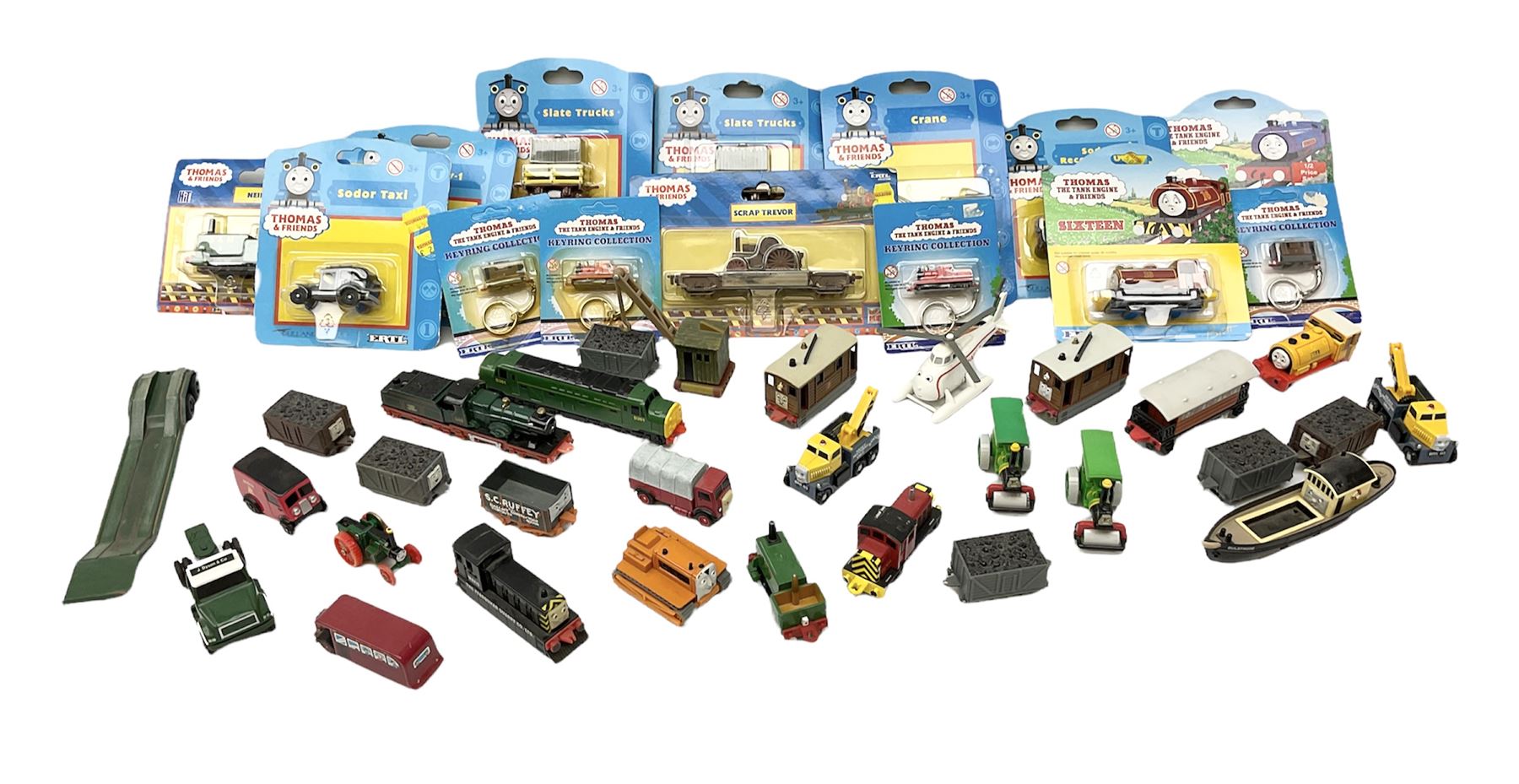 Ertl Thomas the Tank Engine and Friends die-cast models including carded Scrap Trevor, Slate Trucks, Neil, Wilbert, Sodor Taxi, Sodor Recovery Unit, Crane and four key rings; together with various uncarded models including locomotives, coal wagons, steam rollers, boat transporter, recovery units etc (over forty items)