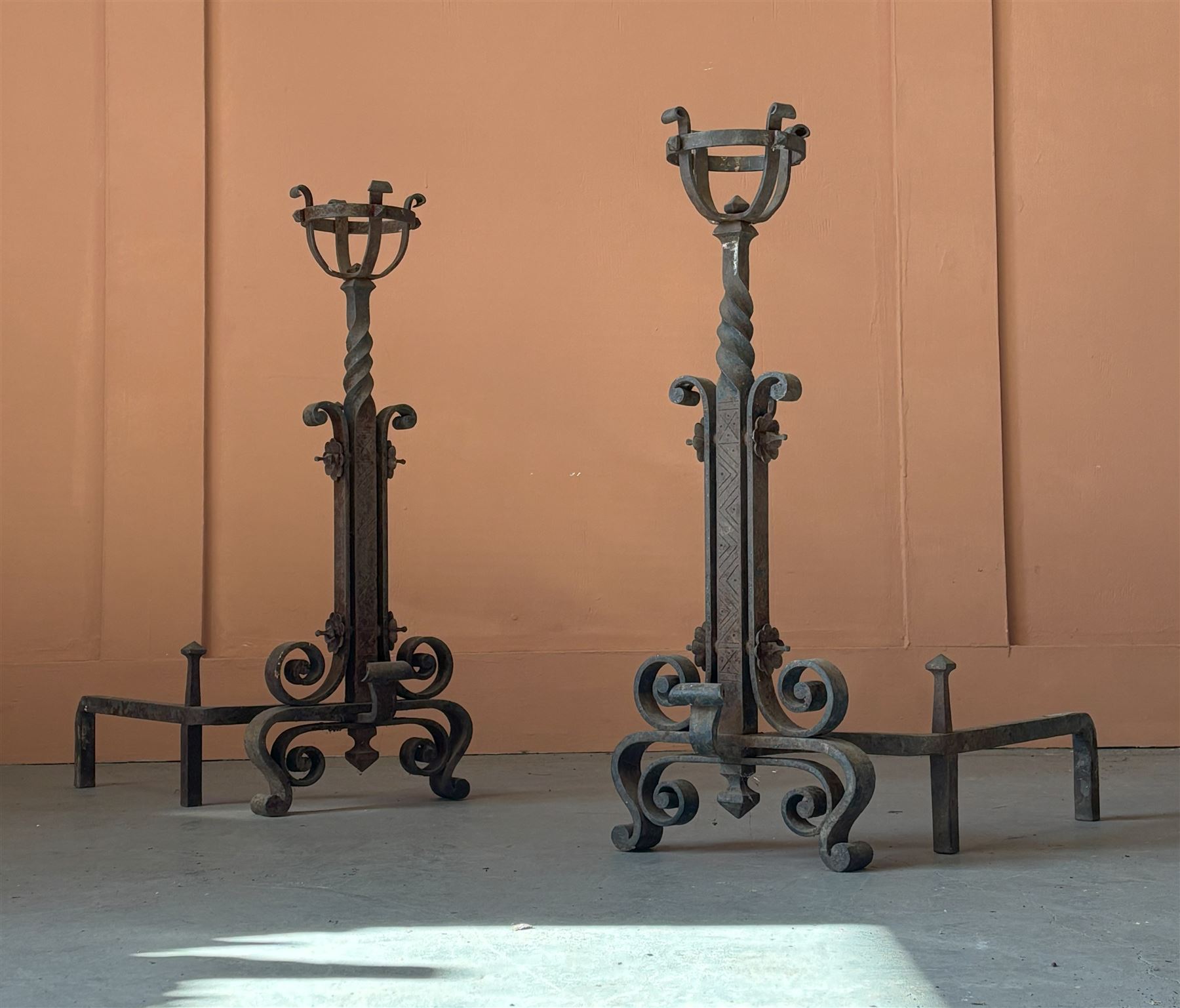 Impressive pair of wrought iron and-irons, 19th century, each formed as fire baskets, on a scrolling base. H77cm, W32cm, D60cm. - COLLECTION BY APPOINTMENT FROM: The White House, Thirsk Road, Easingwold, York, YO61 3NF - CALL 01723 507111 TO ARRANGE