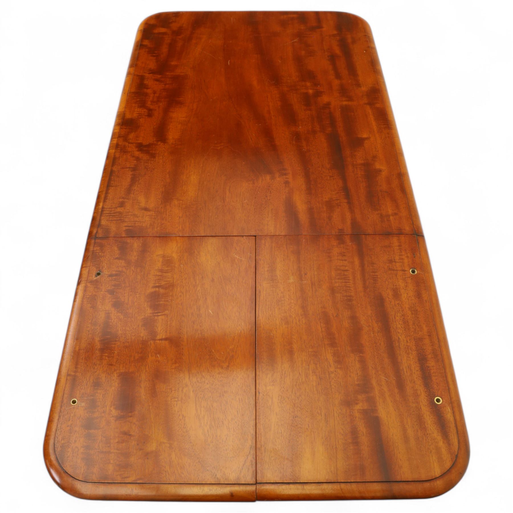 William IV mahogany reading table, the rectangular top with rounded corners and moulded edge, one end fitted with two hinged adjustable reading slops with two rests, the sliding top with a sprung stay mechanism, supported on a single tapered faceted column  with turned collar on a quatreform base with compressed bun feet