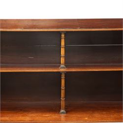 Regency period mahogany waterfall-bookcase chiffonier, the raised back with two open shelves supported by central ring-turned pilasters, fitted with twin doors with sage-green pleated fabric facias, over two drawers with satinwood stringing, raised on front sabre supports