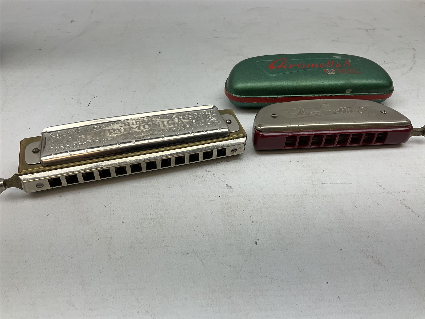 German M. Hohner Chrometta 9 harmonica in case, together with Hohner Chromonica harmonica
