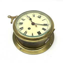 Smiths ship's brass cased bulkhead clock, the cream dial with Roman numerals, black hands and red sweep seconds hand, single train movement D20.5cm