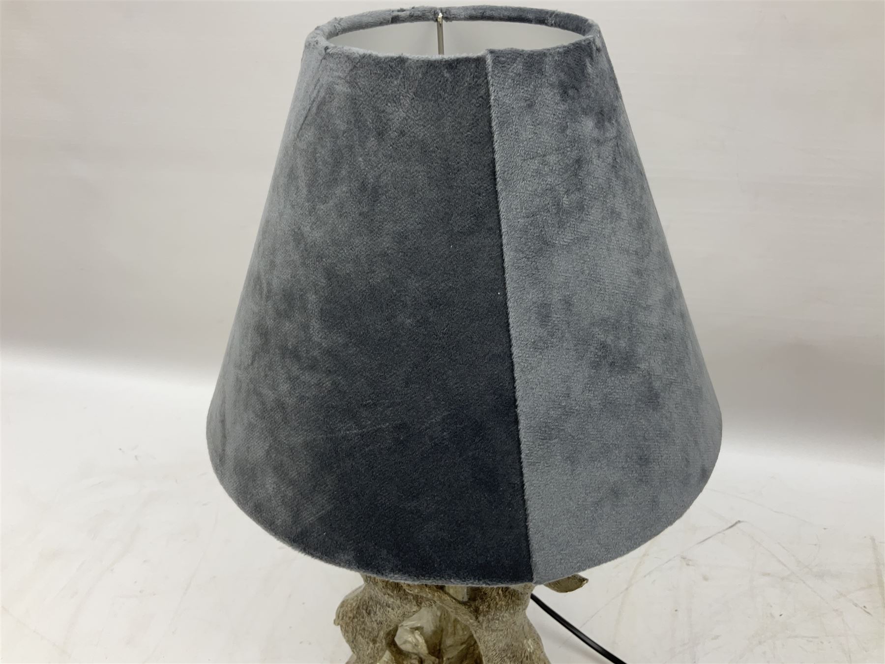 Silver composite table lamp, modelled as a pair of boxing hares, with a grey velvet shade, H45cm