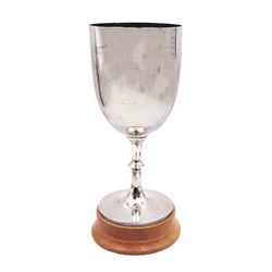 1920s silver trophy cup, of plain form, upon knopped stem and circular spreading foot, body with worn presentation engraving, hallmarked Francis Howard Ltd, Sheffield 1921, upon wooden base, including base H27.5cm