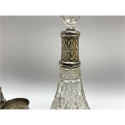 Early 20th Century glass scent bottle with silver collar, hallmarked G E Walton & Co Ltd 1912,  another glass bottle with silver collar stamped Birmingham, hallmarks worn and indistinct, cylindrical scent bottle with silver screw thread cap, two silver napkin rings stamped Birmingham 1962 and 1922, and another napkin ring