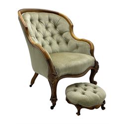 19th century walnut framed drawing room armchair, shaped back and arms and sprung serpentine fronted seat upholstered in buttoned laurel green fabric, raised on cabriole supports with cartouche and acanthus carved knees (W65cm H89cm); with matched footstool, circular top over shaped moulded apron, on foliate carved cabriole feet (W34cm)