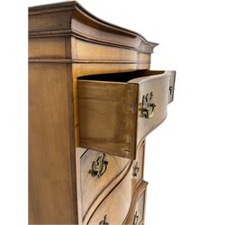 Burton Reproductions walnut chest on chest, fitted with six serpentine drawers