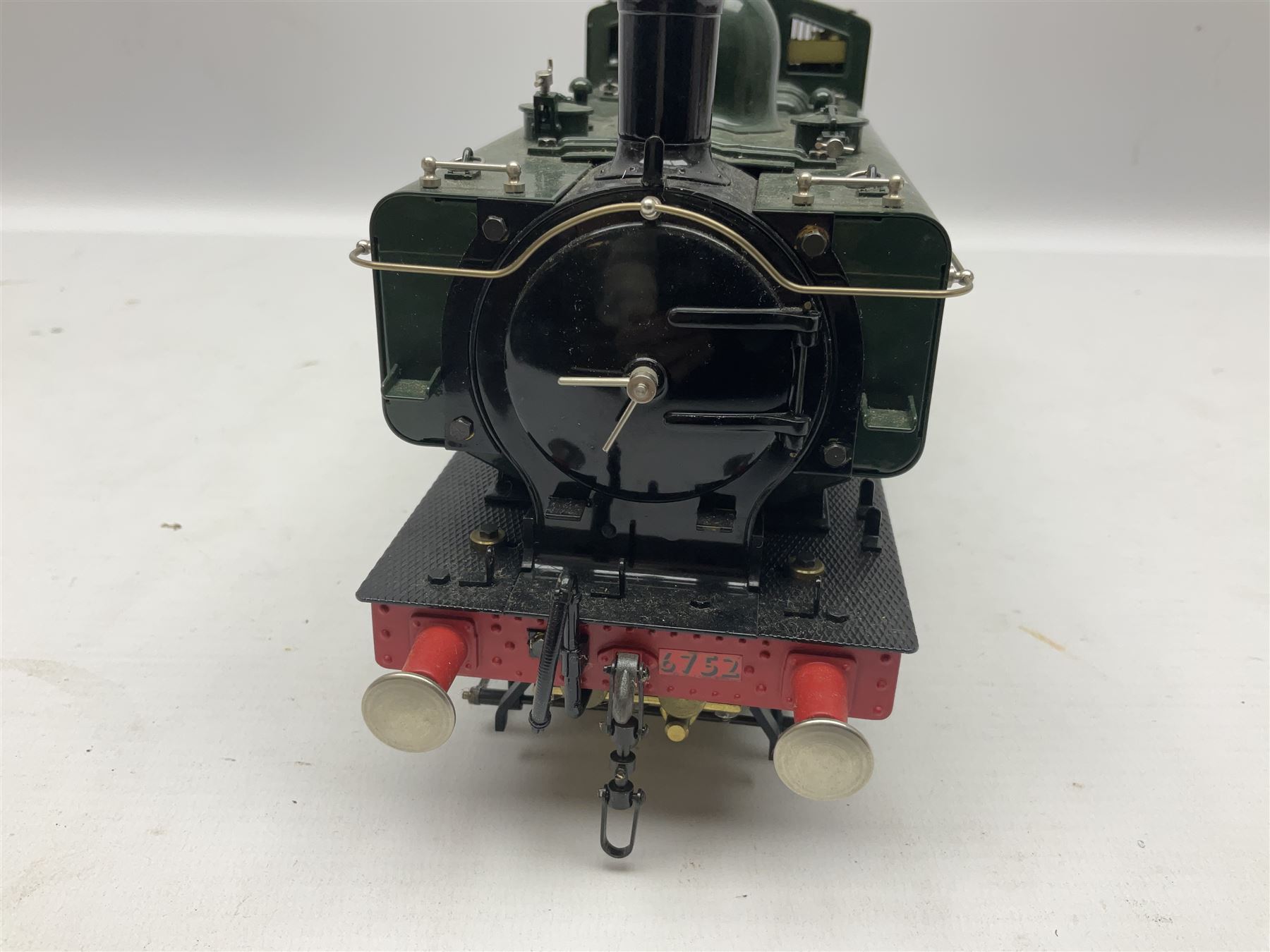 Gauge 1 - Aster 0-6-0 Great Western Railway Pannier tank locomotive No.6752; spirit fired and live steam powered with fitted steam pressure gauge, water sight glass and other usual fittings; finished in Great Western Railway green livery with GWR initials to the pannier tanks, fitted steps, handrails, checker plate, lamp irons, buffers and vacuum hoses; L31cm W8.5cm