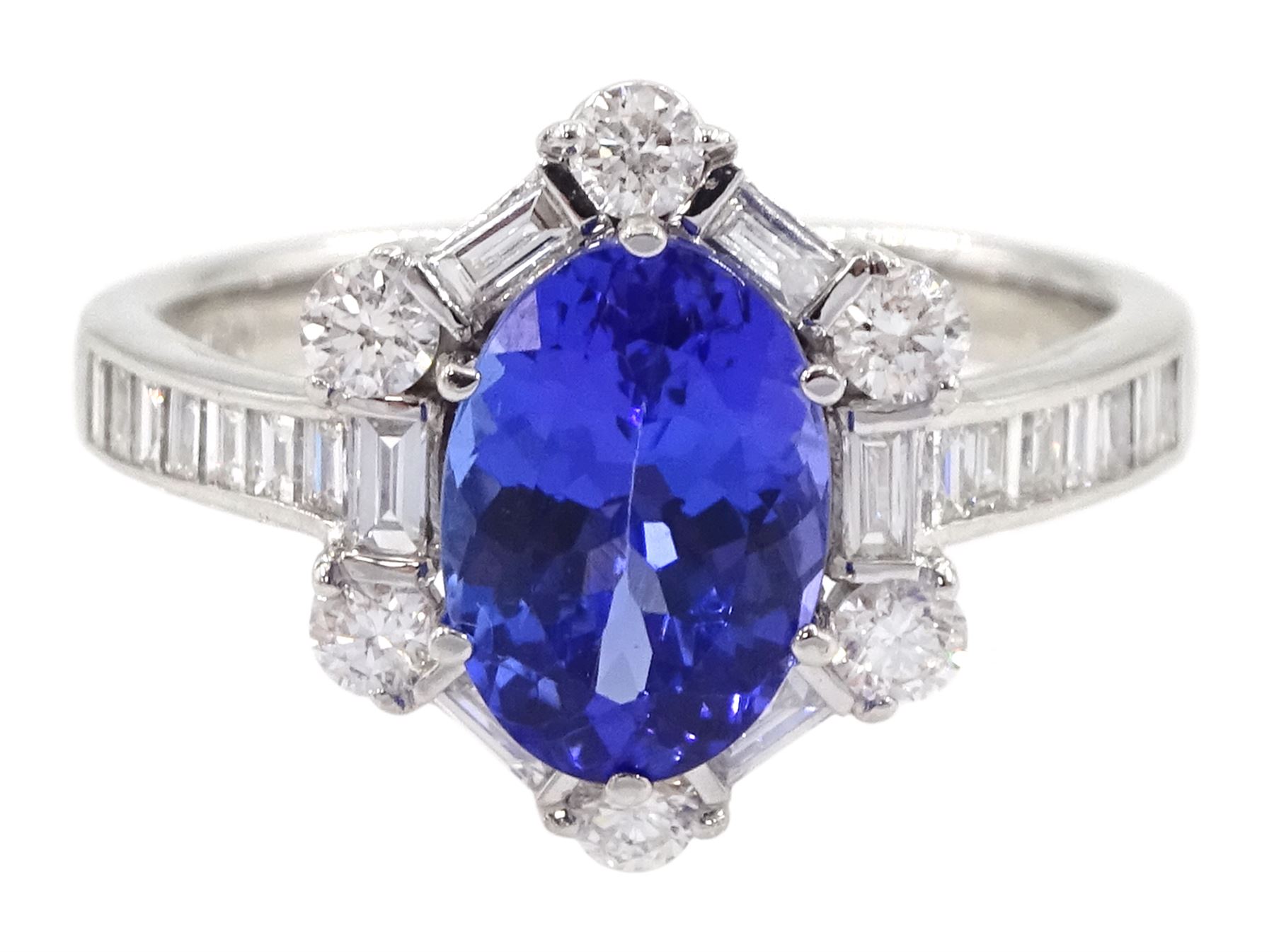 18ct white gold tanzanite and diamond cluster ring, oval tanzanite, with baguette and round brilliant cut diamond surround and baguette cut diamond shoulders, stamped 750, tanzanite approx 1.80 carat, total diamond weight approx 0.55 carat