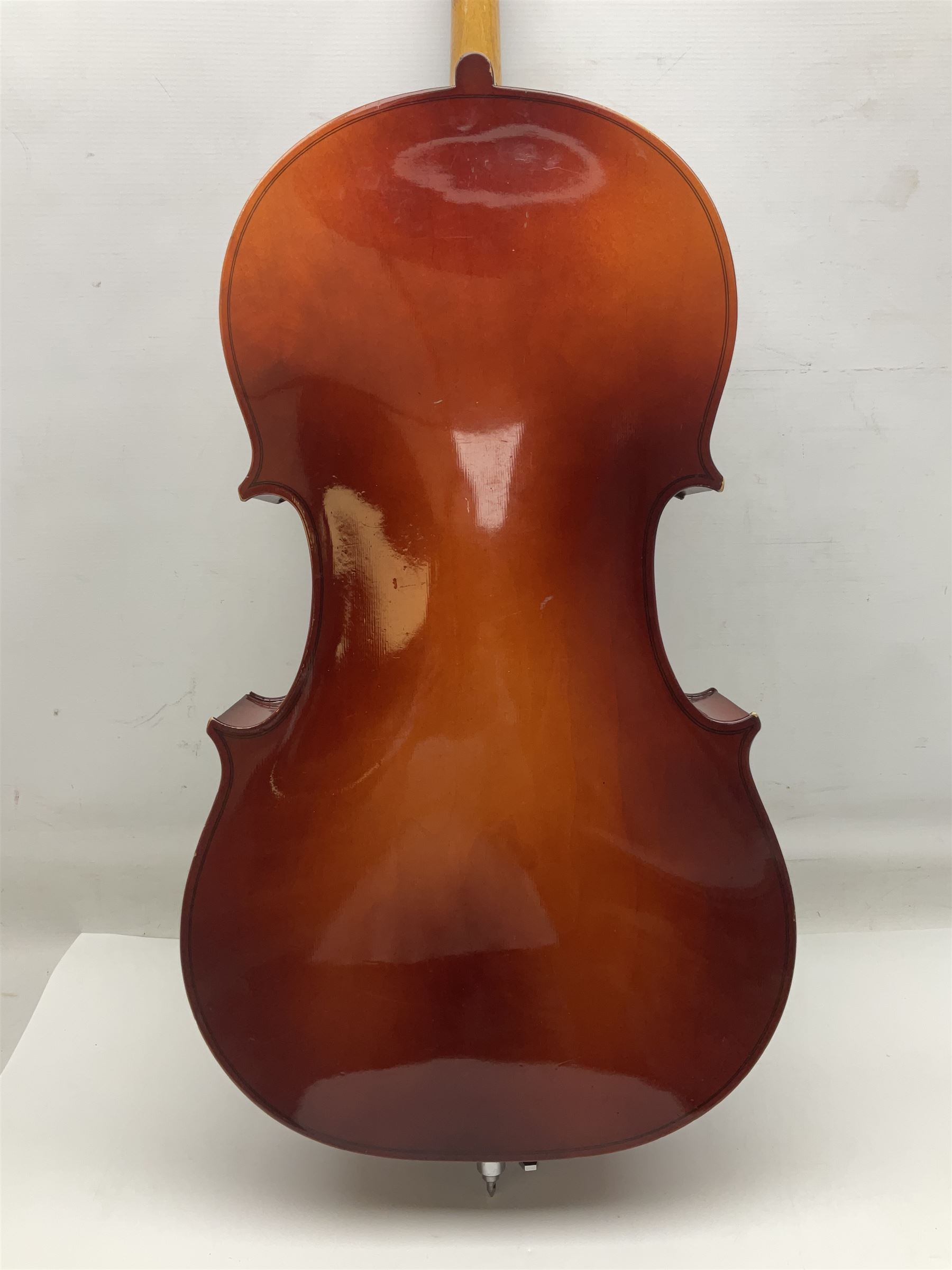 Two student half-size cellos - Boosey & Hawkes Artia with 65cm one-piece back and spruce top; bears maker's label; L104cm overall; and Romanian with 65.5cm two-piece maple back and ribs and spruce top; bears label; L108.5cm overall; each in soft carrying case with two bows (2)
