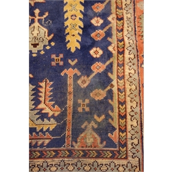  Uzbekistan tree of life carpet, blue ground field with stylised floral and foliage decoration, 310cm x 280cm  