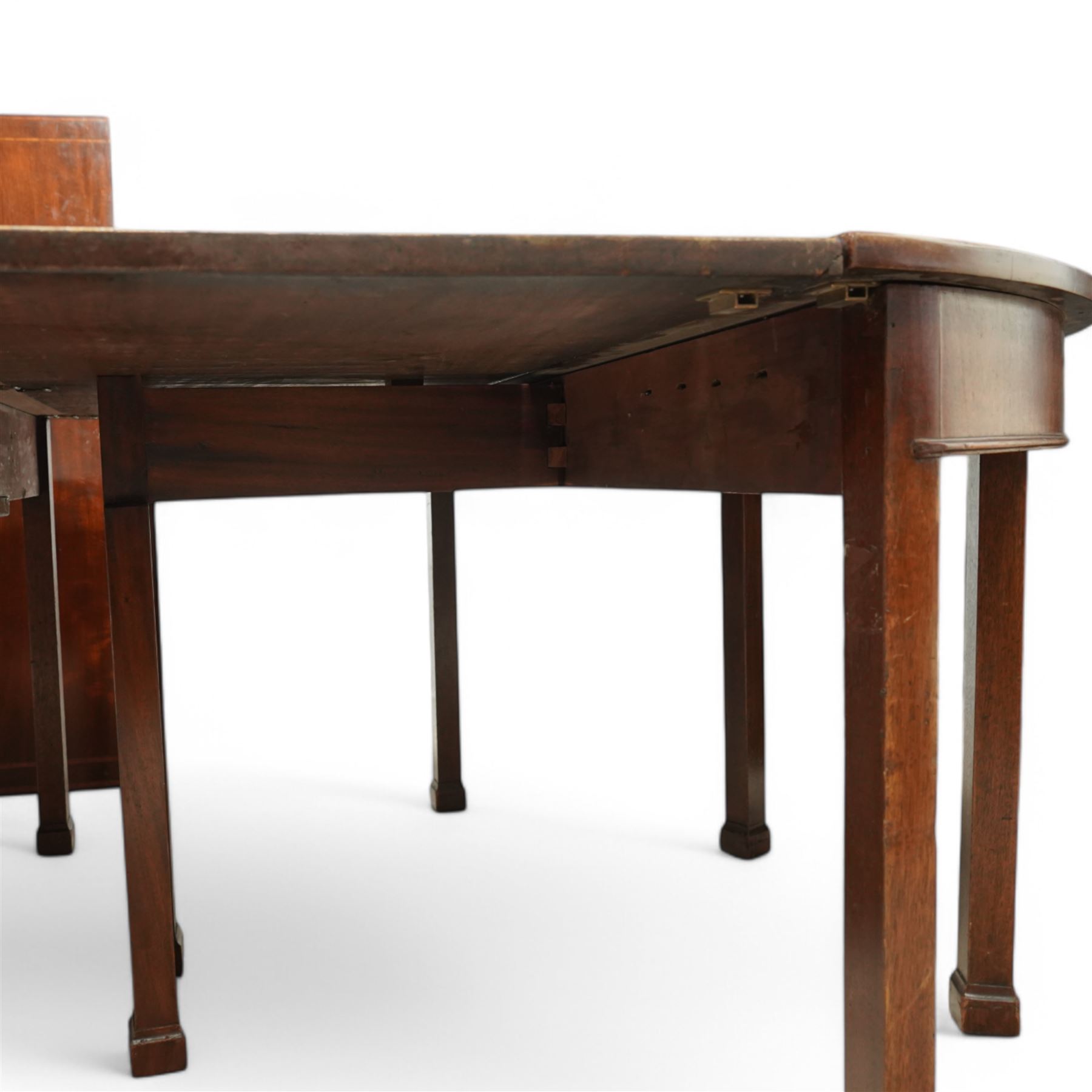 19th century and later mahogany extending dining table (12' 7’'), two D-ends, central drop-leaf table and two additional leaves, with satinwood bands, on square supports with block feet (lacking forks)