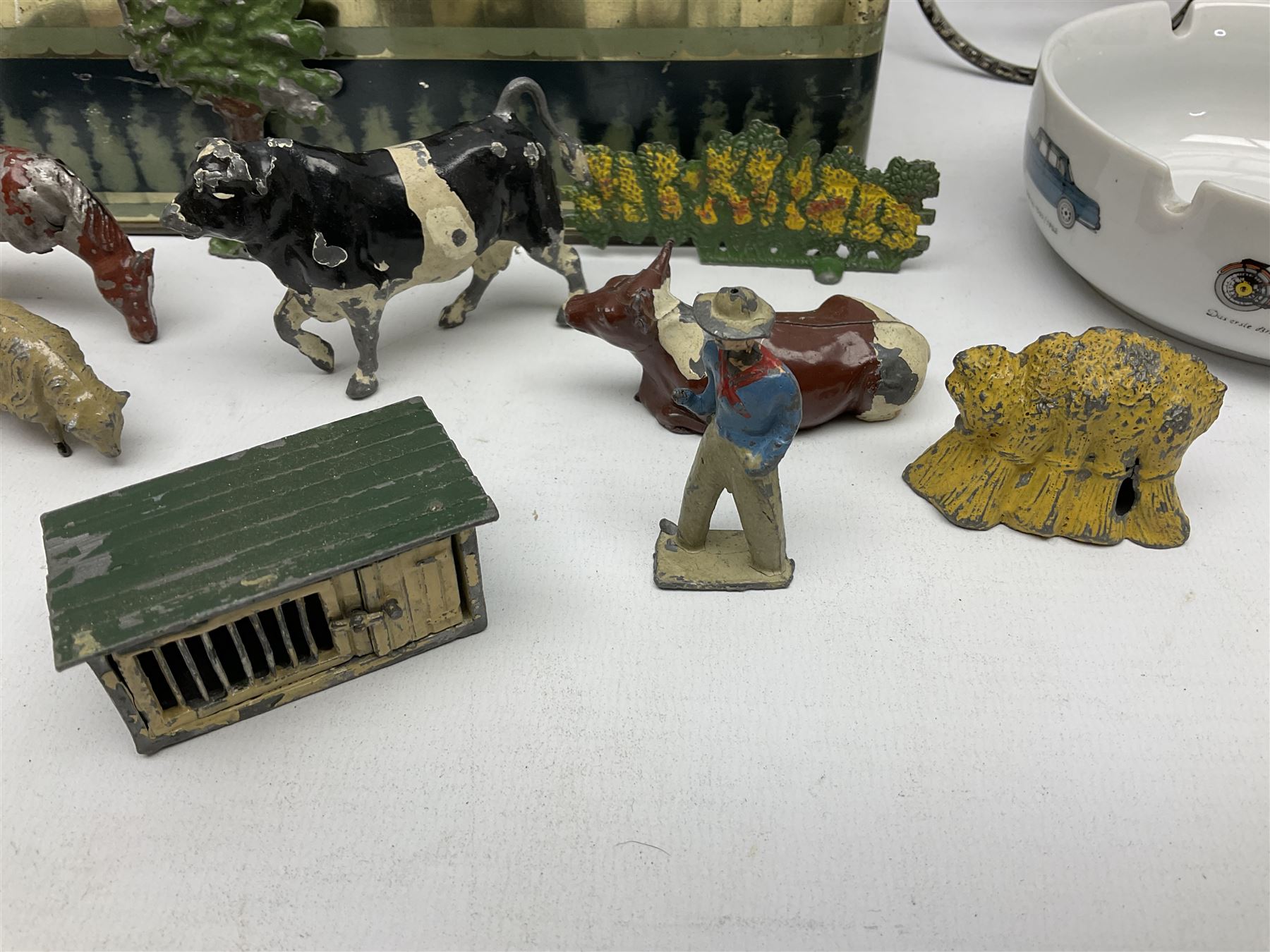 Chad Valley clockwork Fordson Major Tractor, a group of play worn Britains and other lead and metal farm animals, figures and accessories including a kennel, haystacks, dovecote, cows, sheep etc, together with a diecast model of a Tandem Bike L31cm