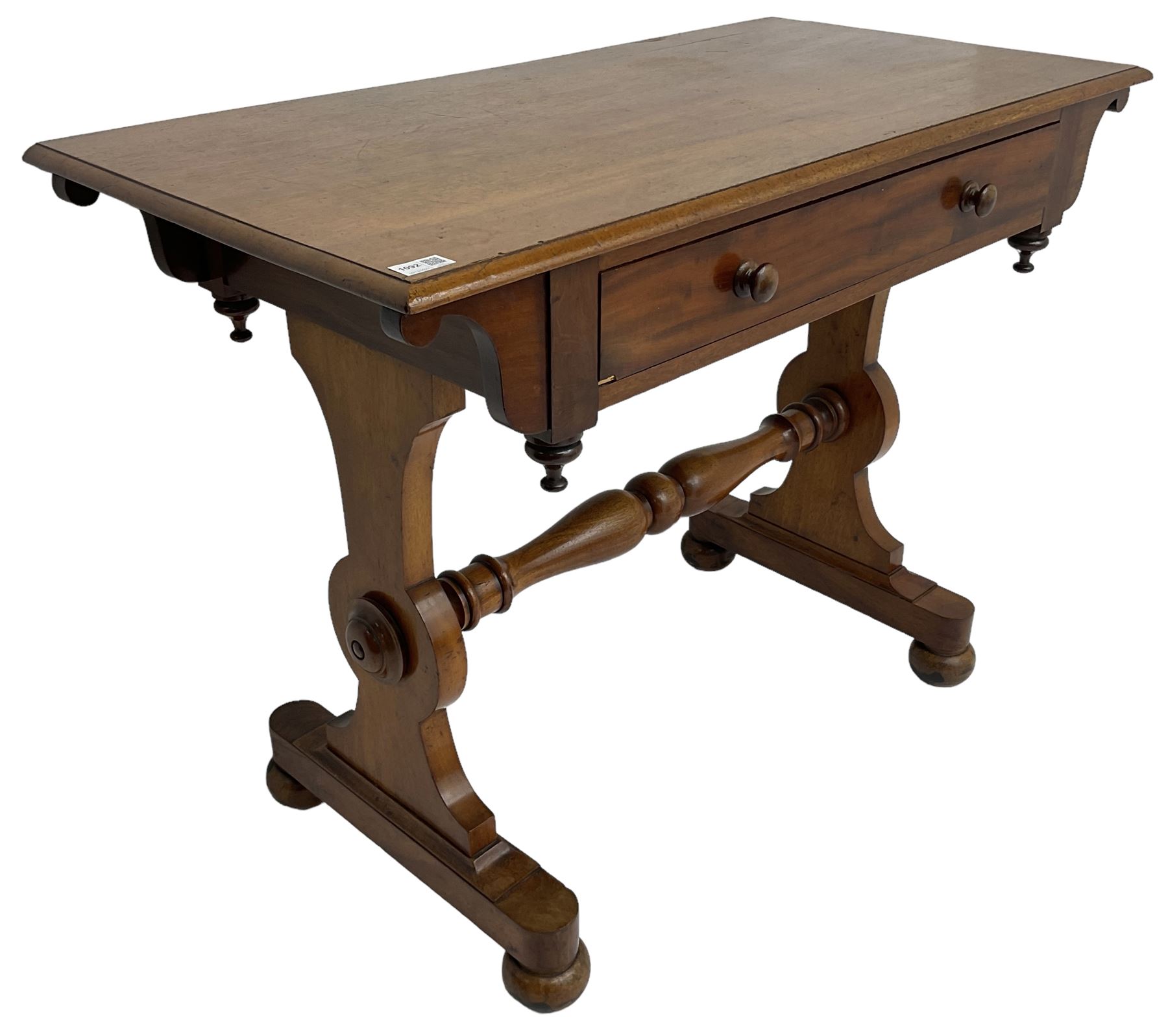 Victorian design mahogany side table, fitted with single drawer, raised on shaped end supports with bun feet, united by turned stretcher