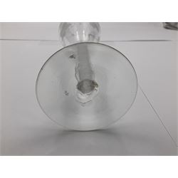 Set of three 18th century style wine glasses, each with funnel bowl etched with fruit vine, upon a double series air twist stem and circular foot, H17cm