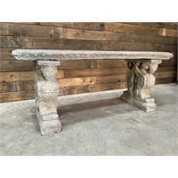Cast stone garden Rams Head bench, two pillars set with architectural rams heads, rectangular slab seat