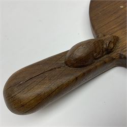 Mouseman - oak kidney-shaped cheeseboard, the handle caved with mouse signature, by the workshop of Robert Thompson, Kilburn 