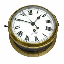 A 20th century Smiths brass cased bulkhead clock with a single train eight-day going barrel movement and balance escapement, white enamel dial with Roman numerals, minute track and five-minute Arabic’s, steel spade hands and centre second hand, dial inscribed “Smiths, Cricklewood N.W, Made in England” brass cast bezel with lock and key, flat glass with silvered sight ring, slow fast balance regulation.
Case diameter 22cm, bezel diameter 19cm.
With key
