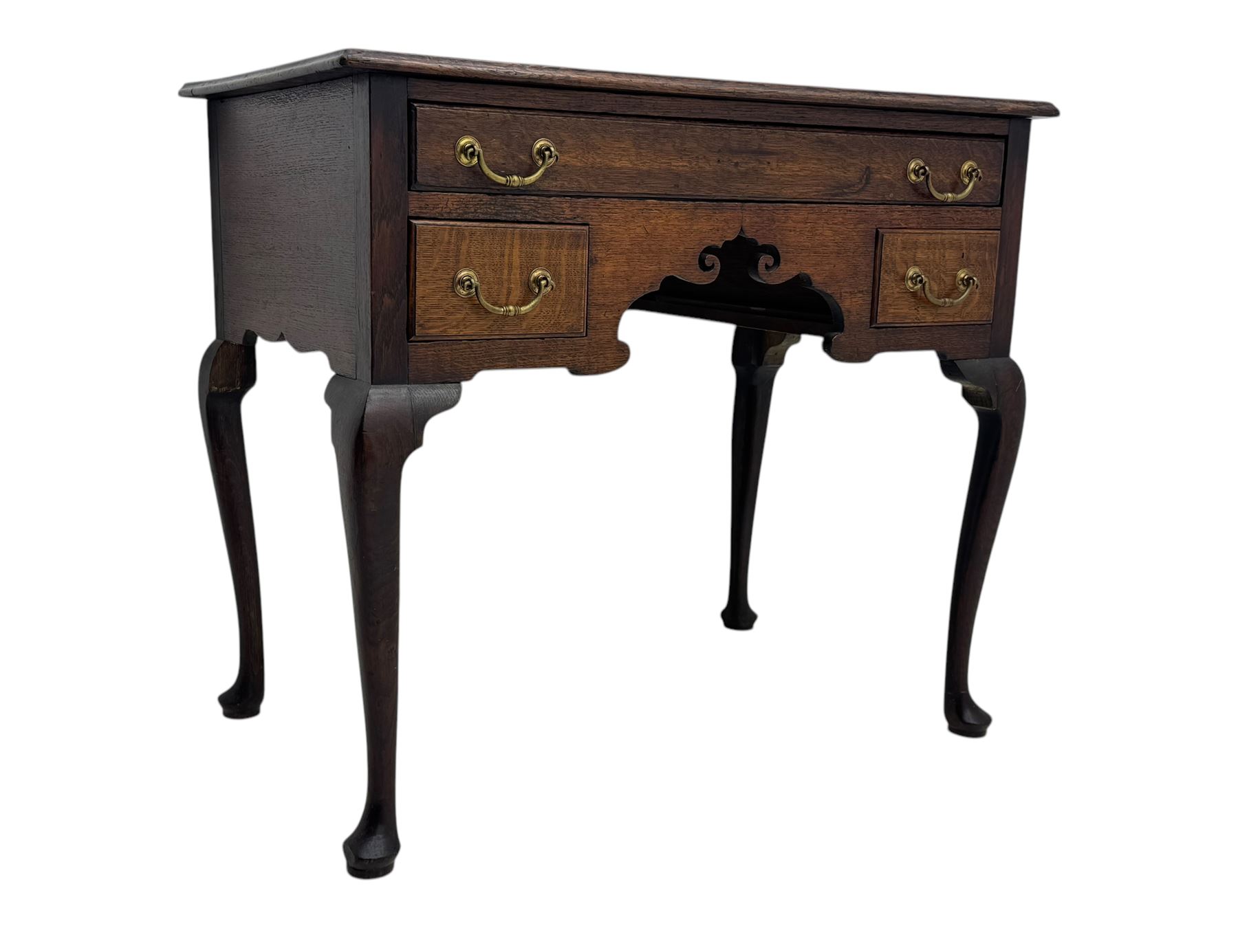 George II oak lowboy, moulded rectangular top over one long and two short drawers fitted with brass drop handles, shaped apron with scrollwork carvings, raised on cabriole supports